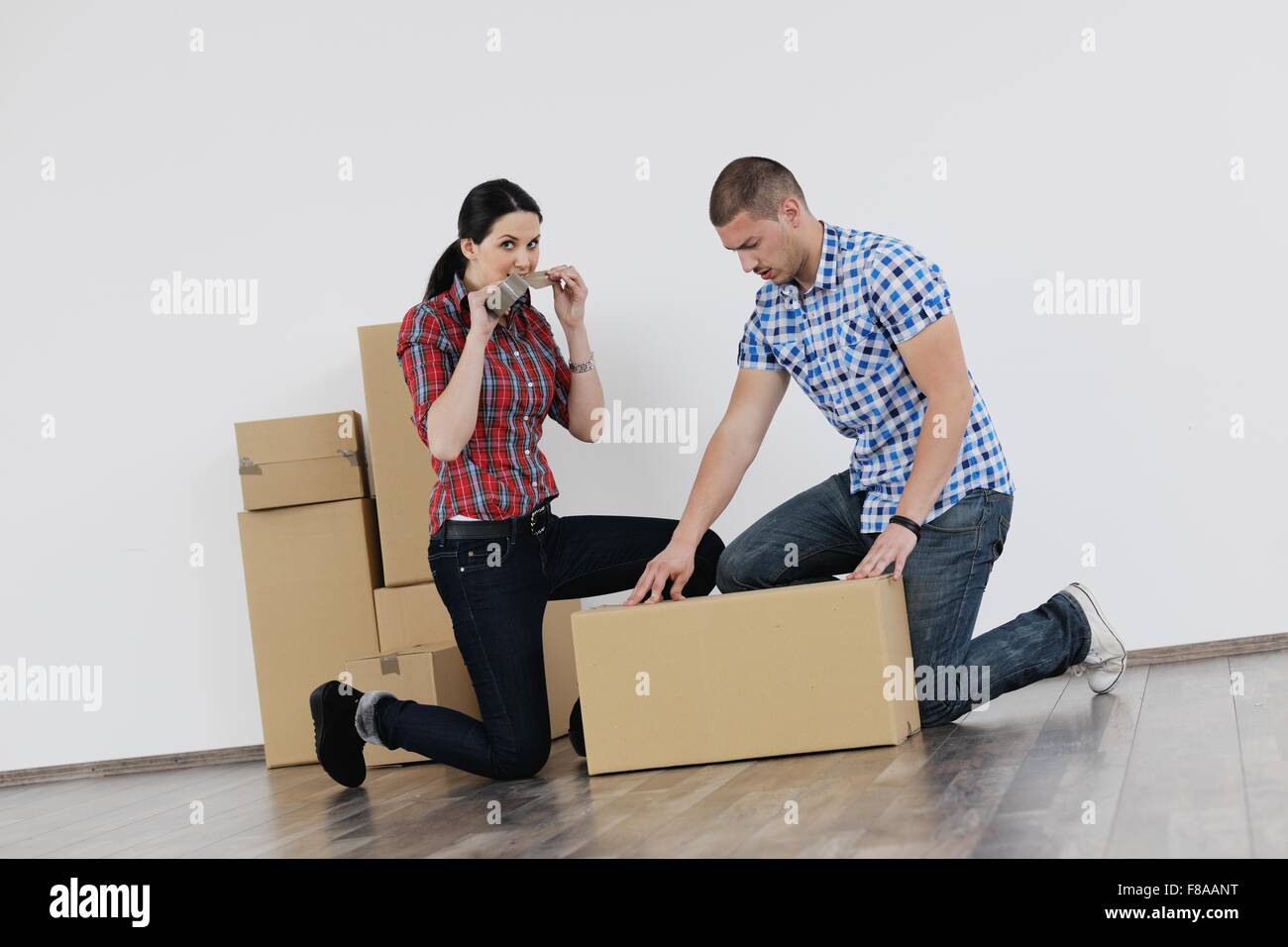 happy Young couple moving in new house Stock Photo - Alamy