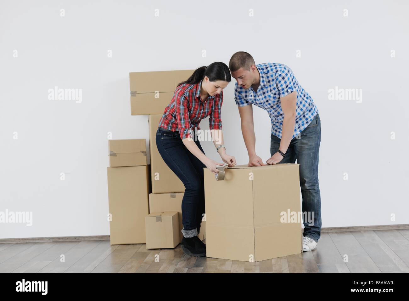 happy Young couple moving in new house Stock Photo - Alamy