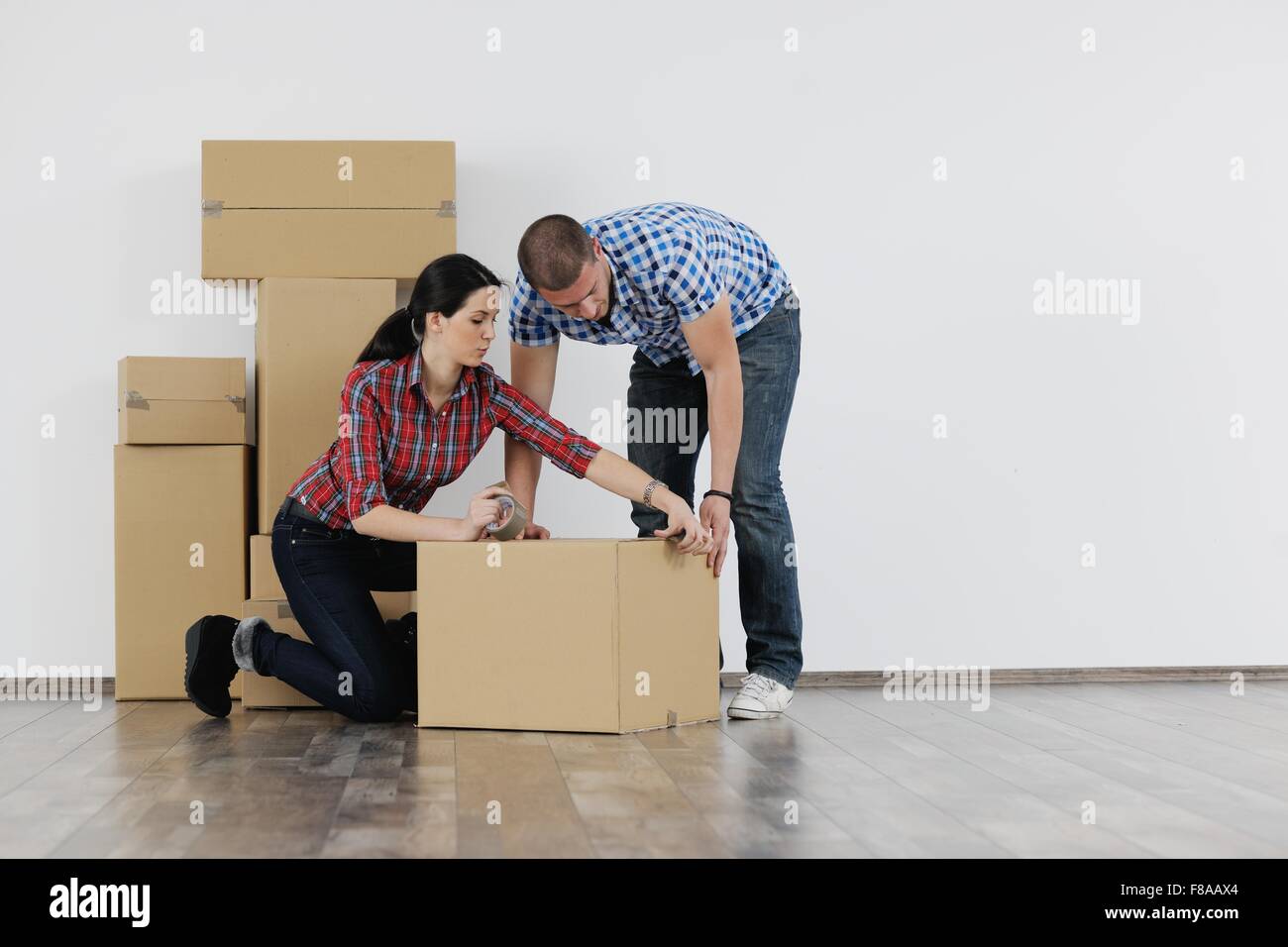 happy Young couple moving in new house Stock Photo - Alamy