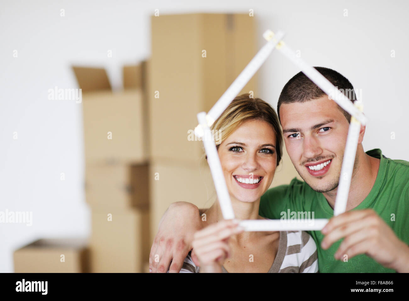 happy Young couple moving in new house Stock Photo - Alamy