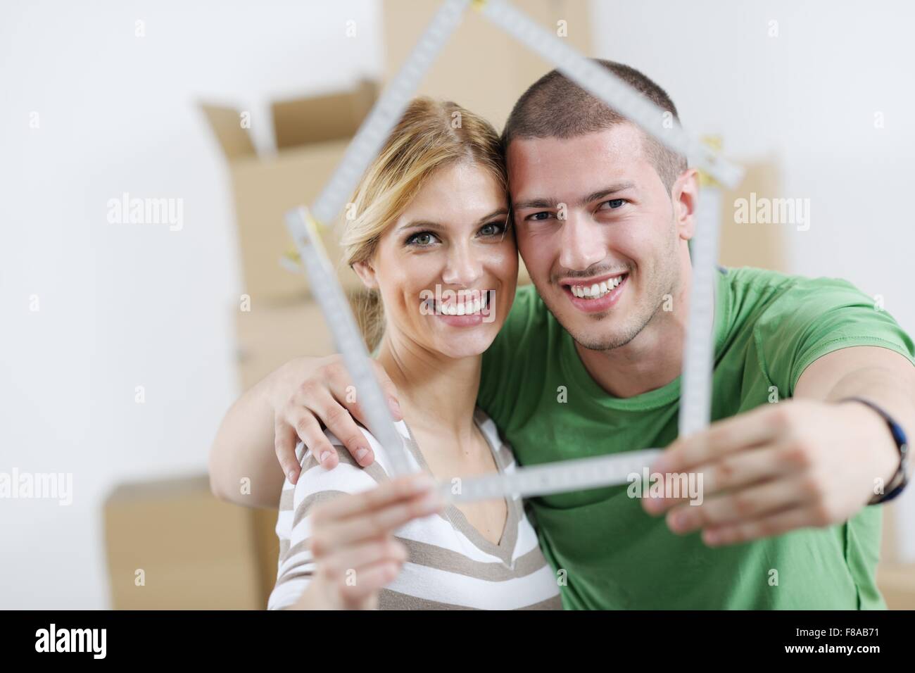 happy Young couple moving in new house Stock Photo - Alamy
