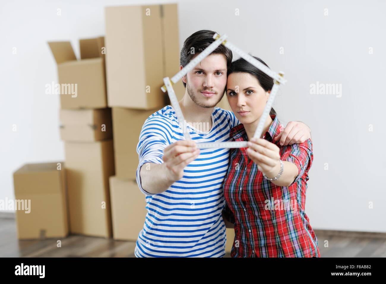 happy Young couple moving in new house Stock Photo - Alamy