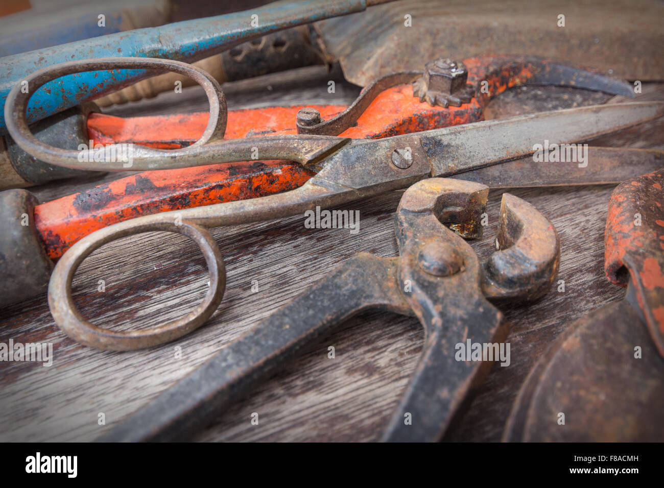 Old rusty tools - vintage gardening tools on wooden background Stock ...
