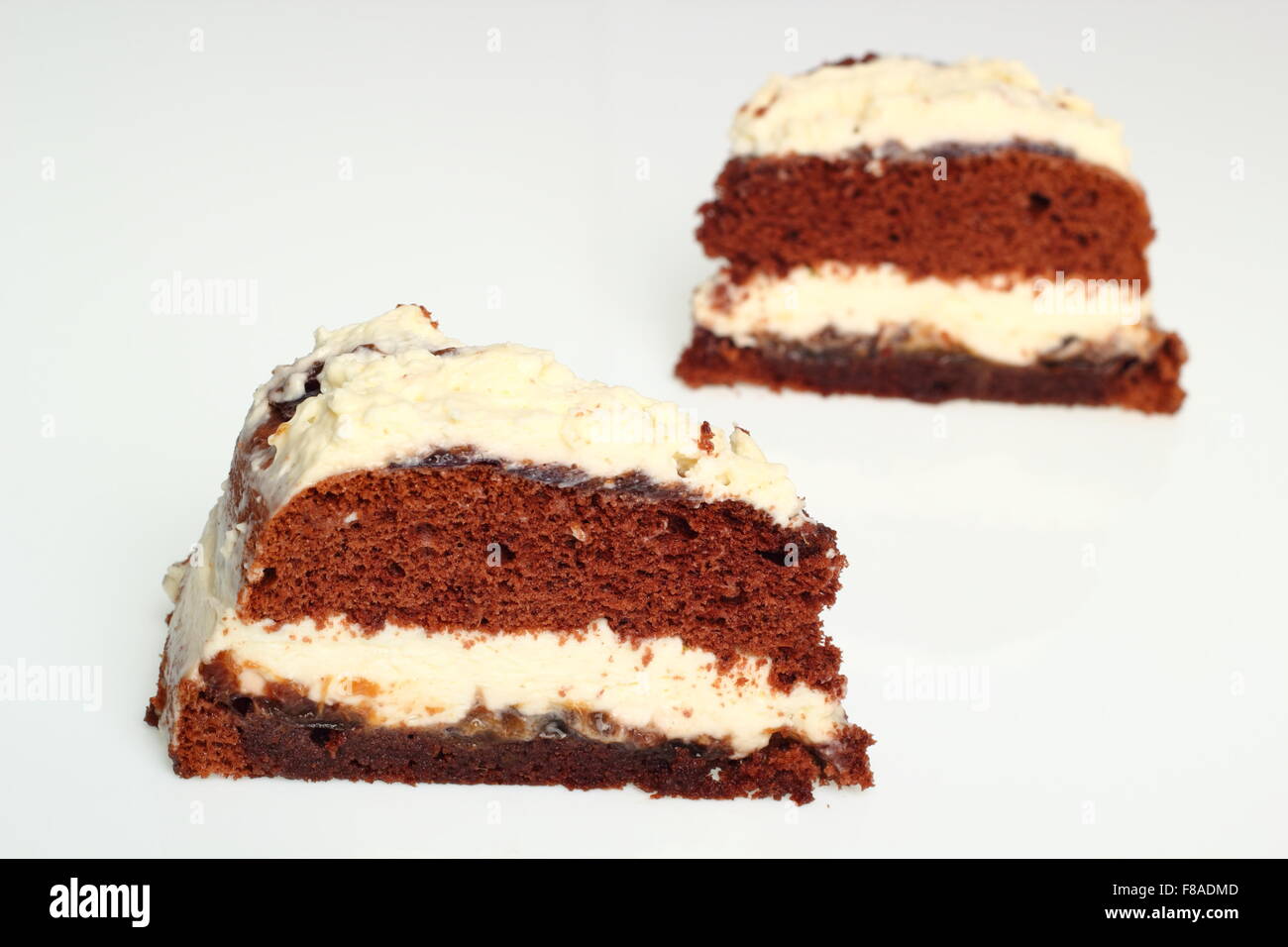 Chocolate Layer Cake (Torte) with Whipped Cream and Jam Stock Photo