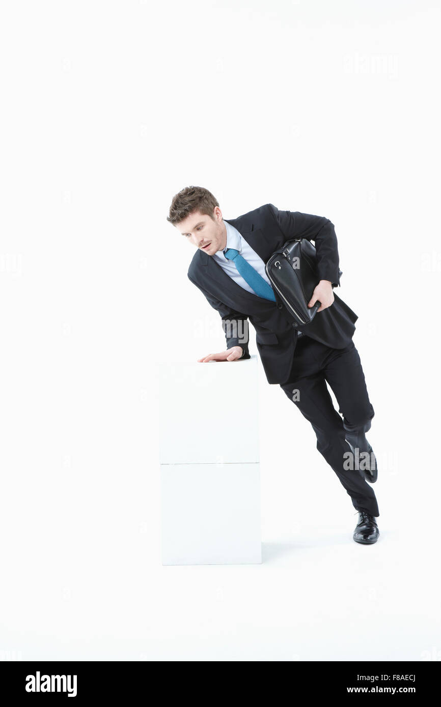 Two blocks of copy space with a man jumping on them Stock Photo