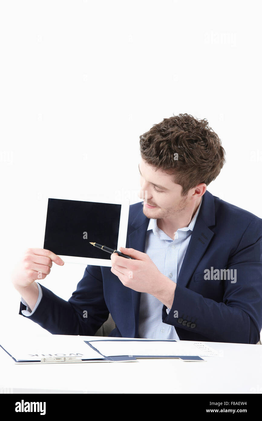 Businessman showing the tablet PC Stock Photo