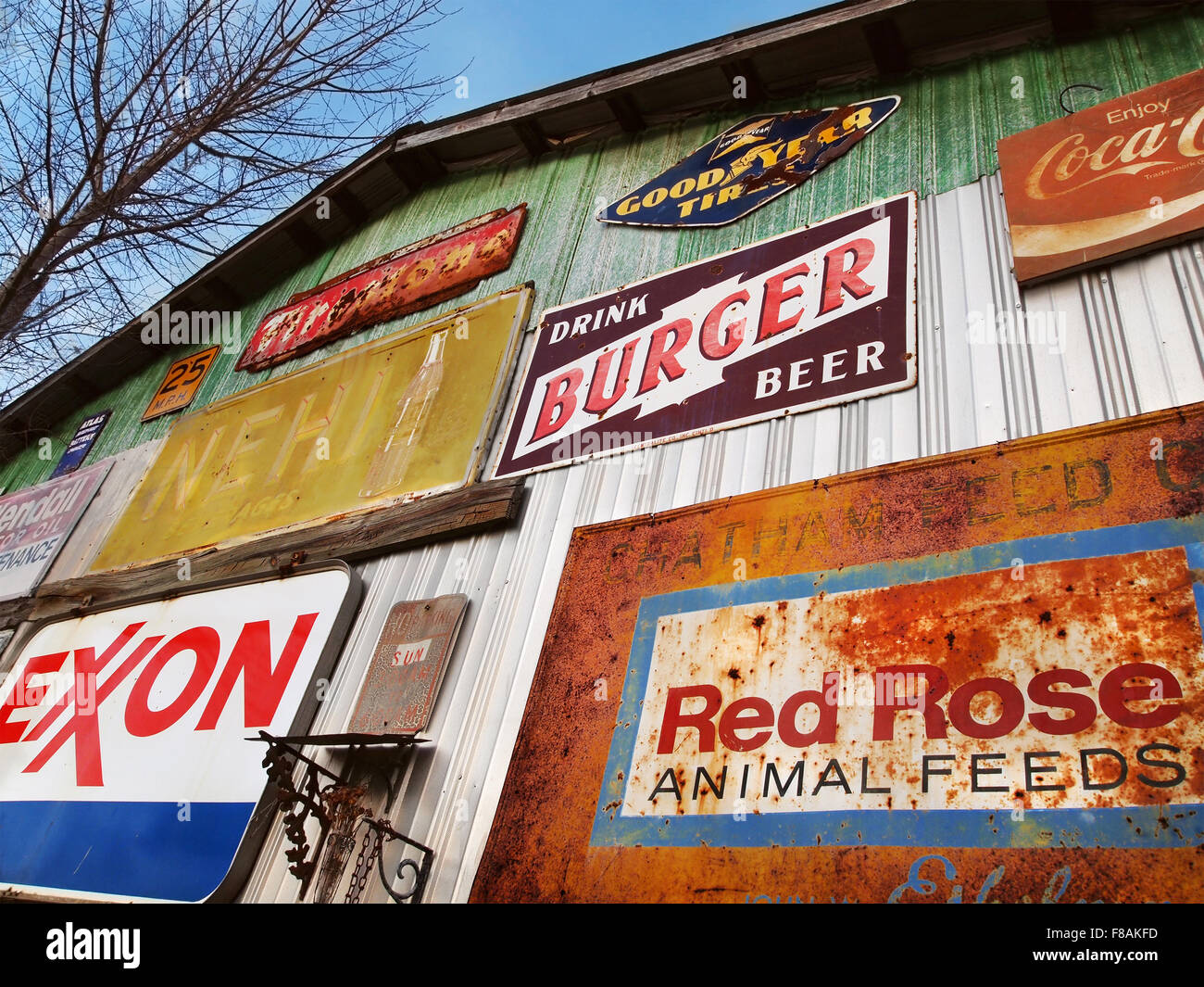 SAVANNAH, GA - FEBRUARY 21, 2015:  A colorful array of vintage advertising signs adorn the outside of an old building at a flea Stock Photo