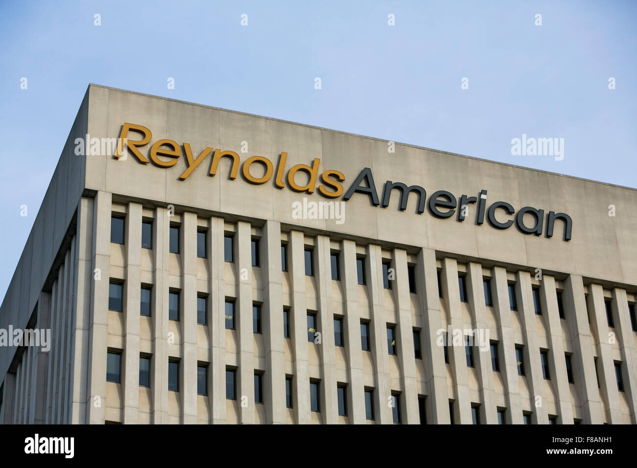 A logo sign outside of the headquarters of Reynolds American, Inc., in Winston-Salem, North Carolina on November 27, 2015. Stock Photo