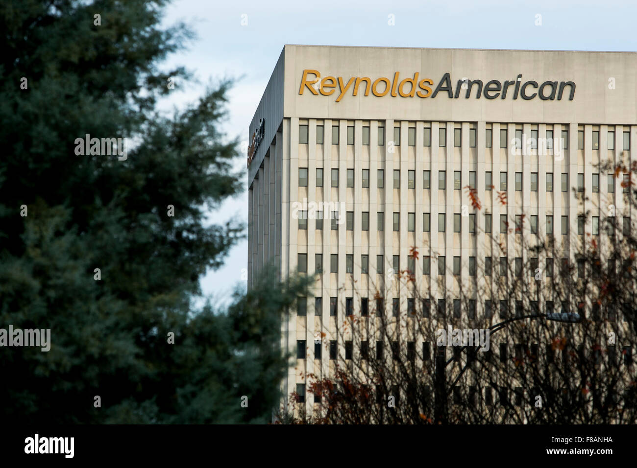 A logo sign outside of the headquarters of Reynolds American, Inc., in Winston-Salem, North Carolina on November 27, 2015. Stock Photo
