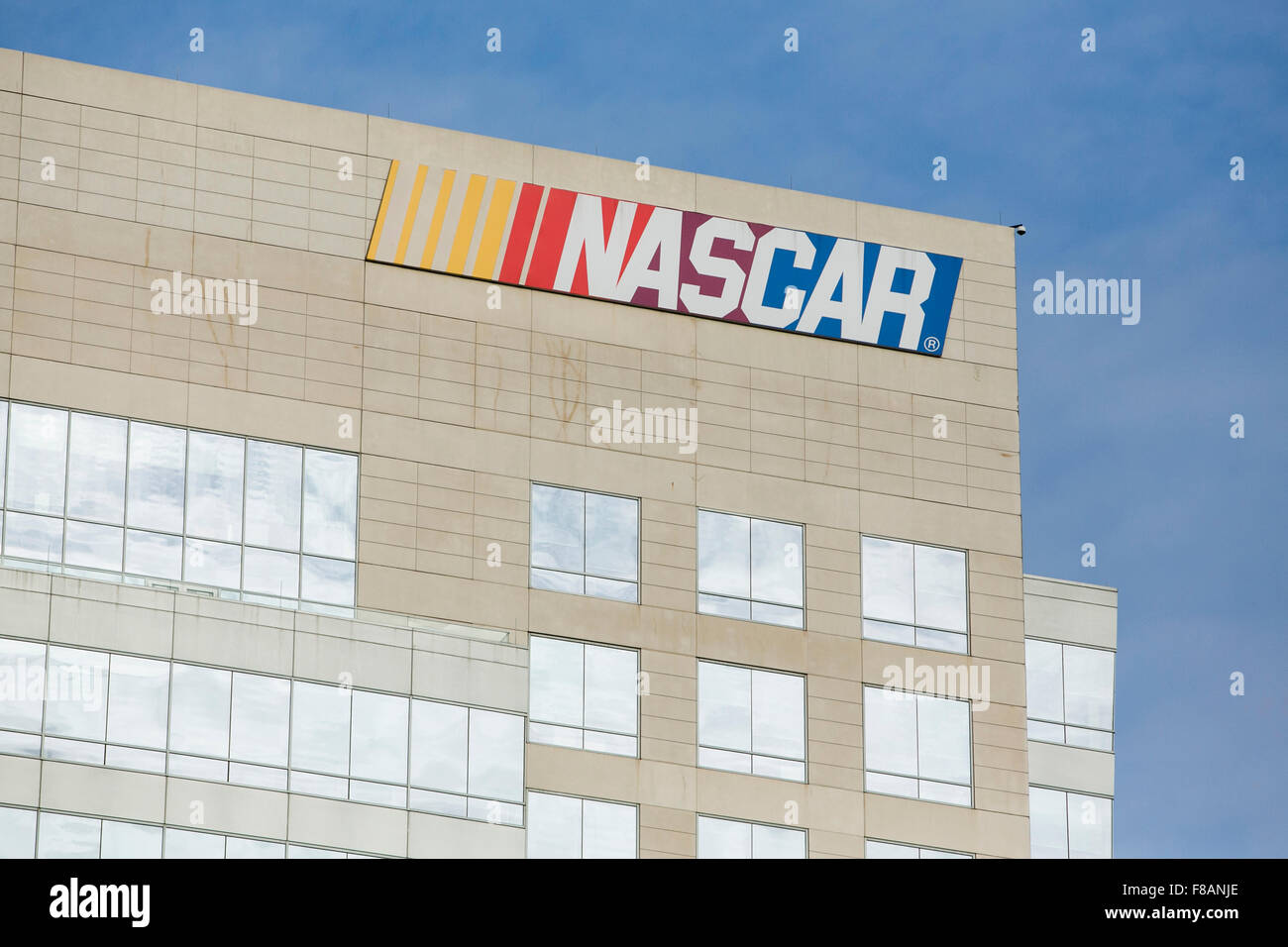 A logo sign outside of a facility occupied by the National Association for Stock Car Auto Racing (NASCAR) in Charlotte, North Ca Stock Photo
