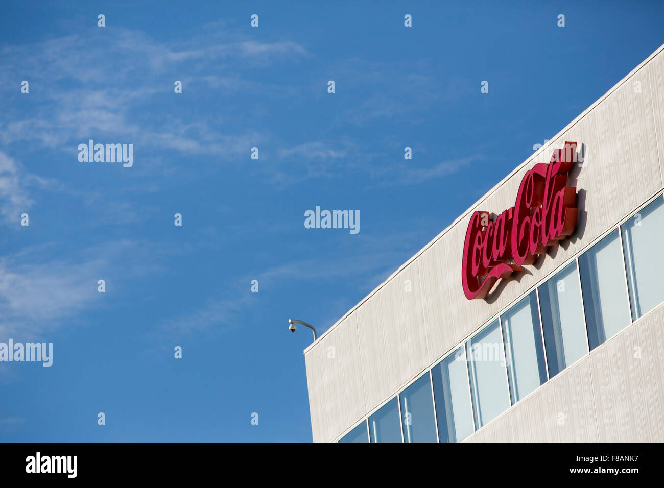A logo sign outside of a facility occupied by Coca-Cola in Charlotte, North Carolina on November 28, 2015. Stock Photo