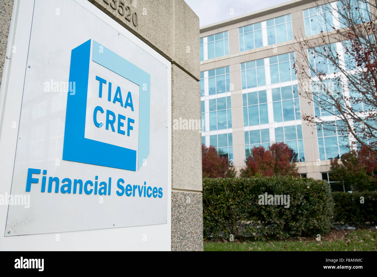 A logo sign outside of a facility occupied by the Teachers Insurance