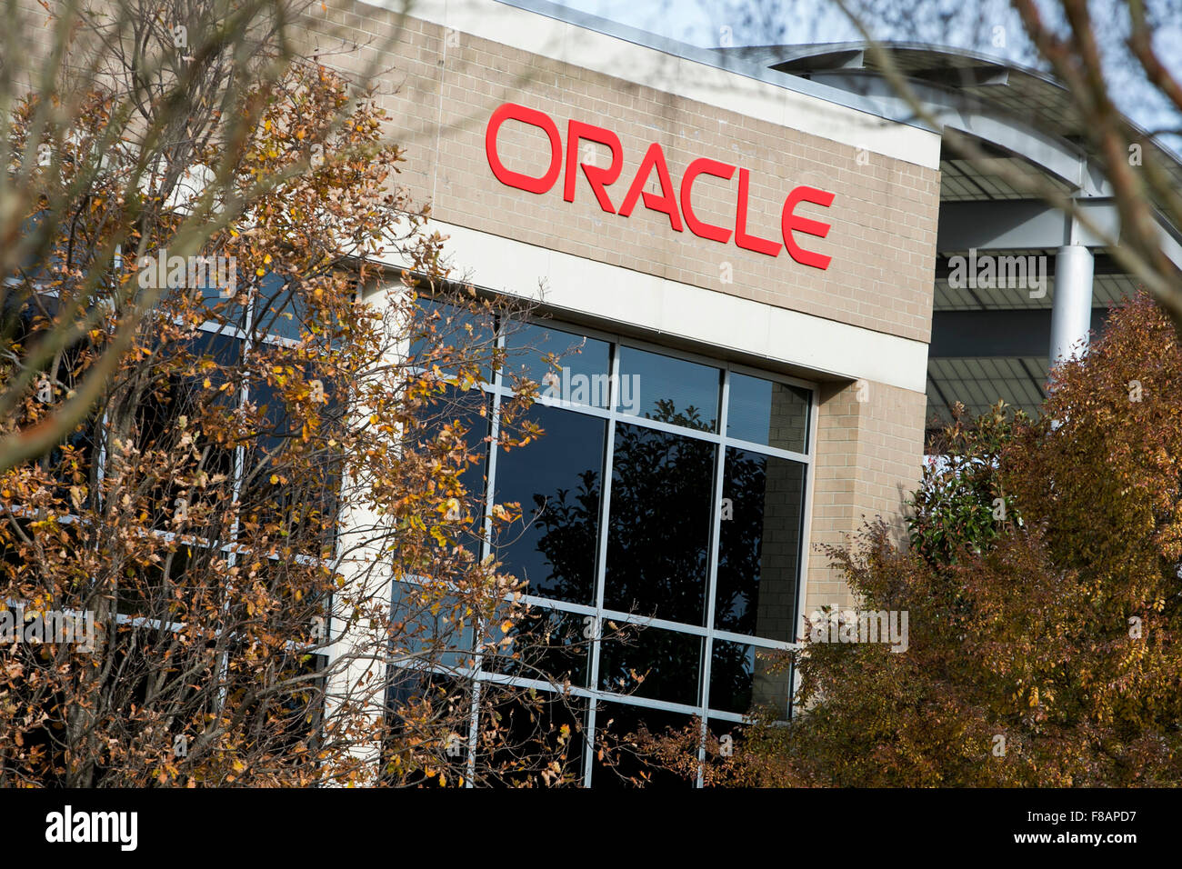 A logo sign outside of a facility occupied by The Oracle Corporation in ...