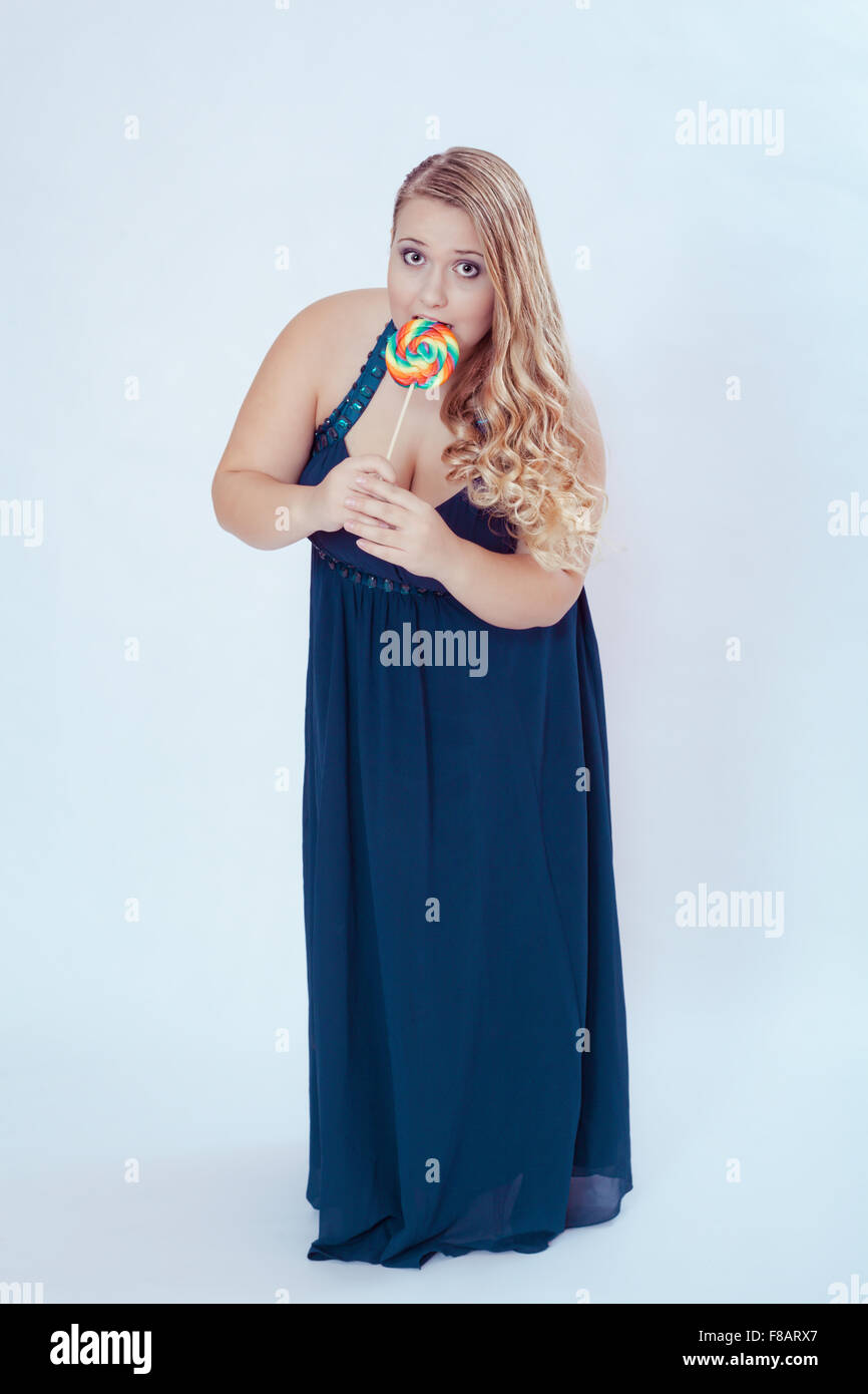 Fat Woman in Blue Dress Eating Lollipop Stock Photo - Alamy Fat Woman in Blue Dress Eating Lollipop Stock Photo - Alamy