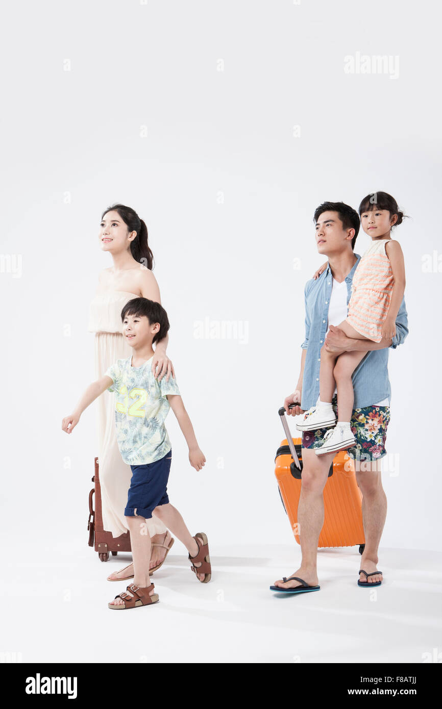 Family walking with carriers for summer vacation Stock Photo