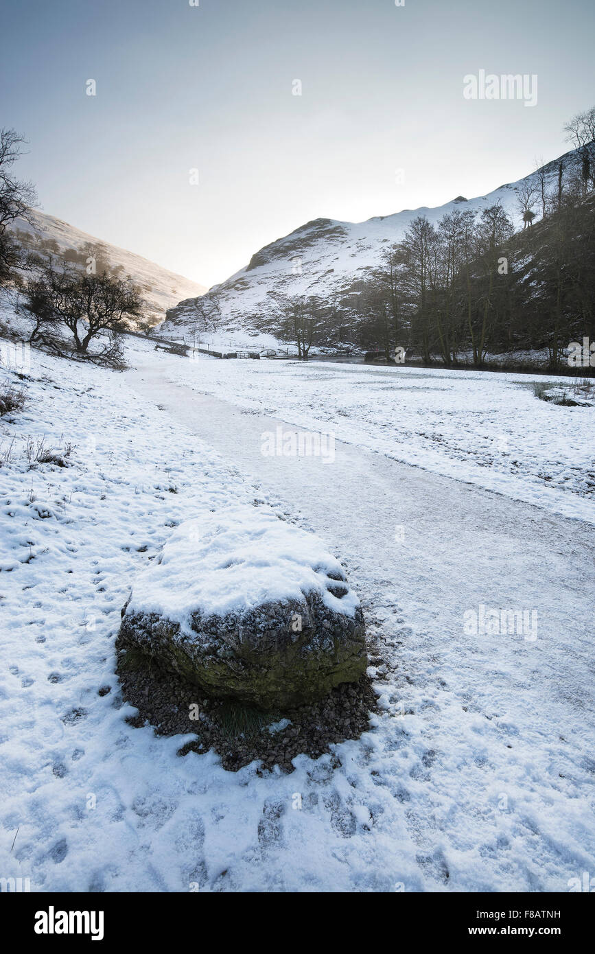River flowing through snow covered Winter landscape in valley Stock ...