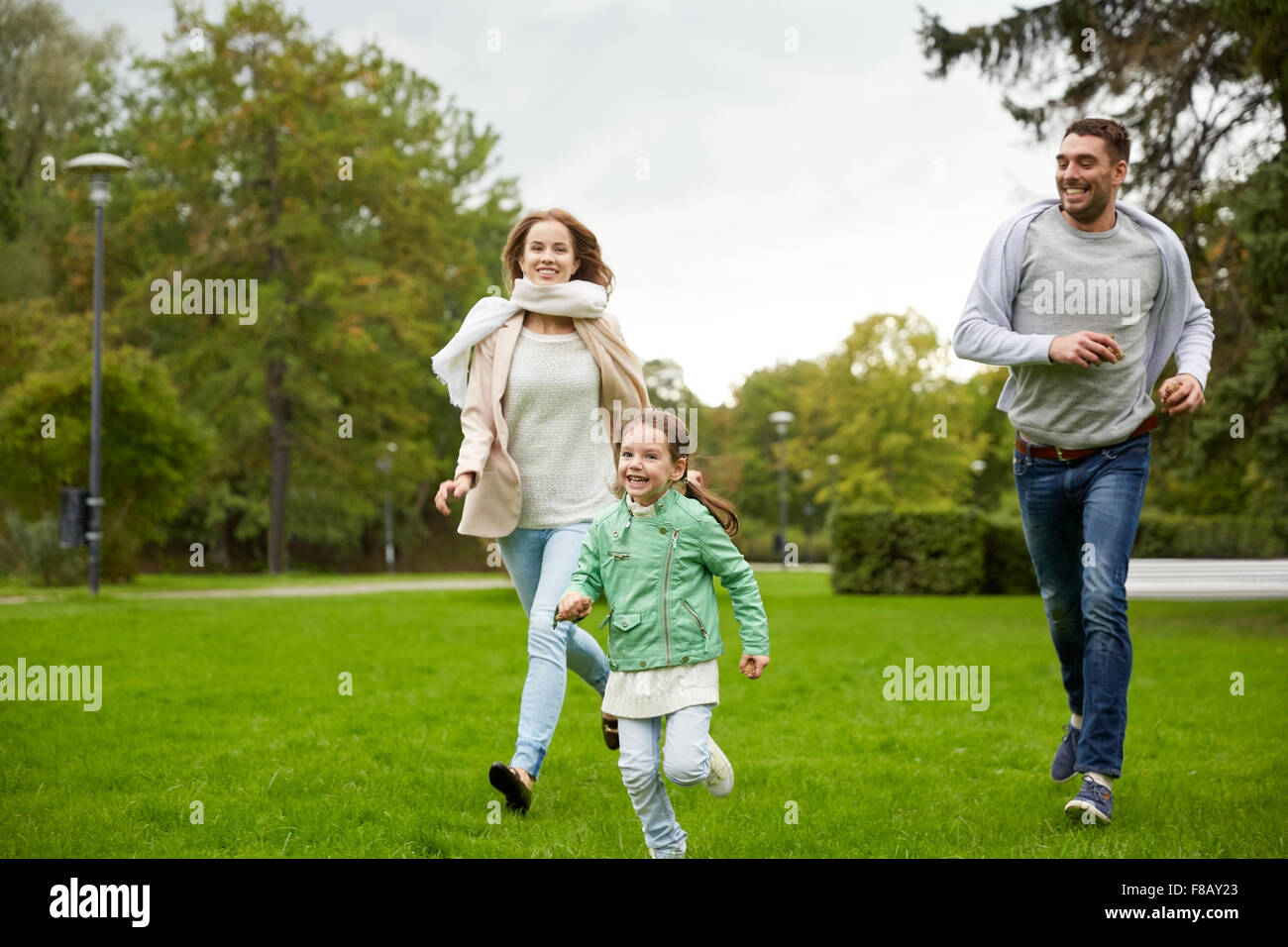 happy family walking in summer park Stock Photo - Alamy
