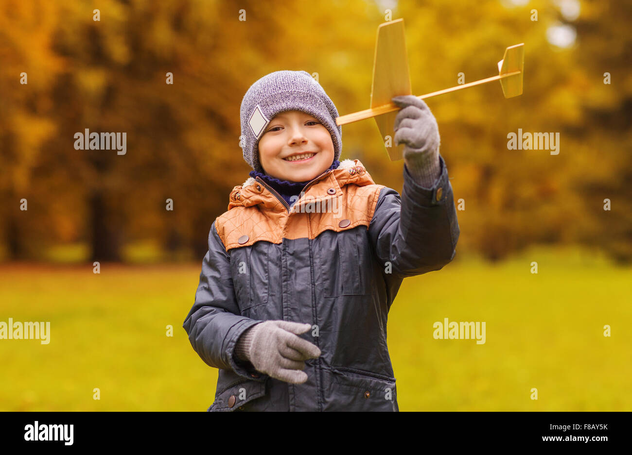 happy little boy playing with toy plane outdoors Stock Photo - Alamy