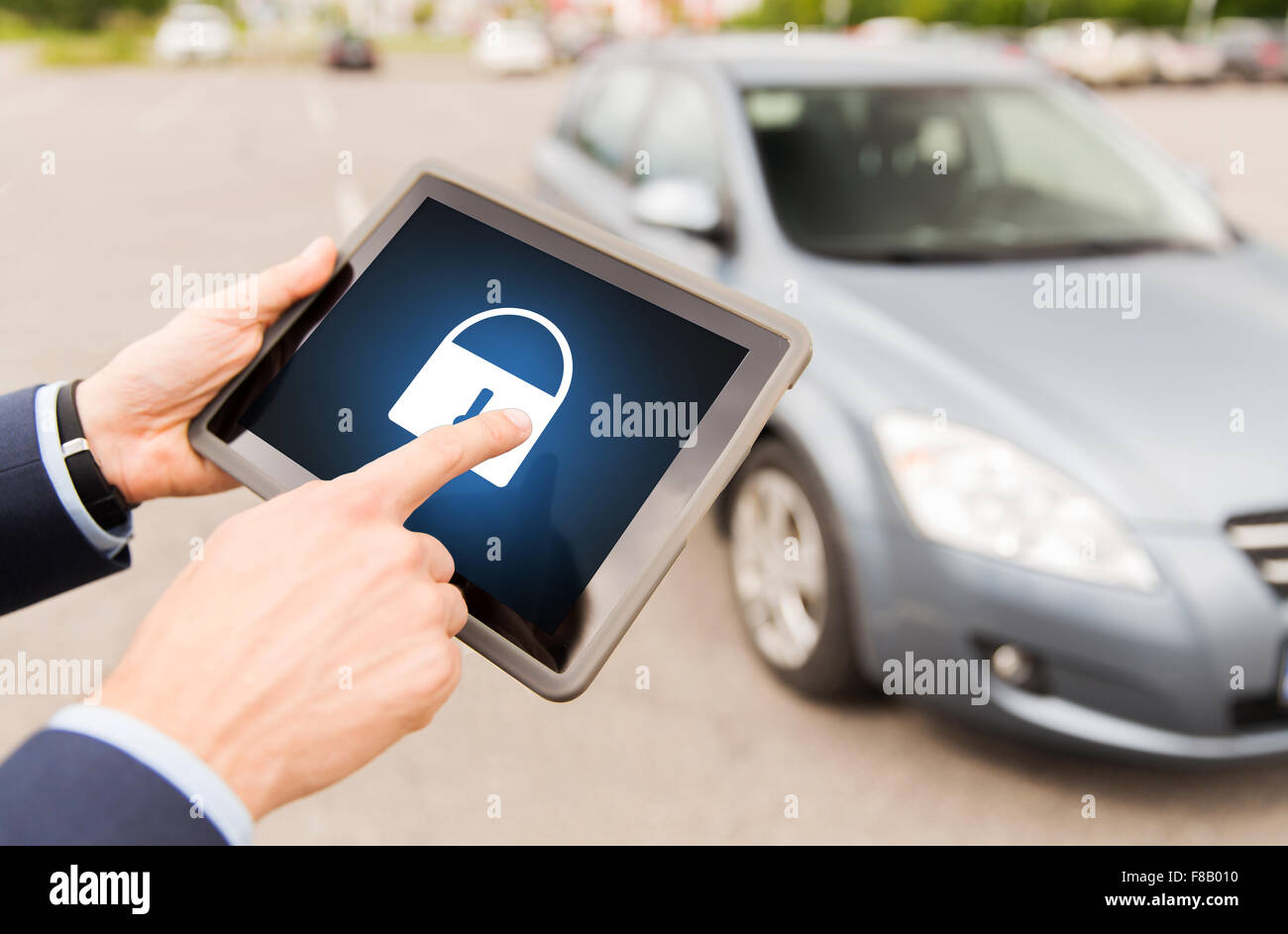 close up of hands with lock icon on tablet pc Stock Photo