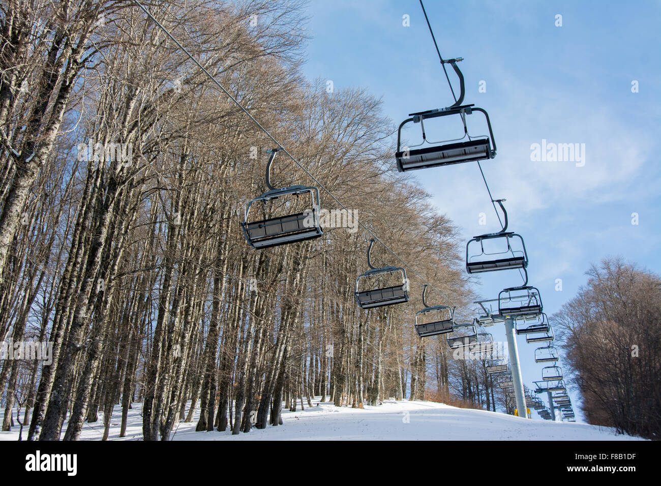 chairlift without people on a snowy mountain Stock Photo