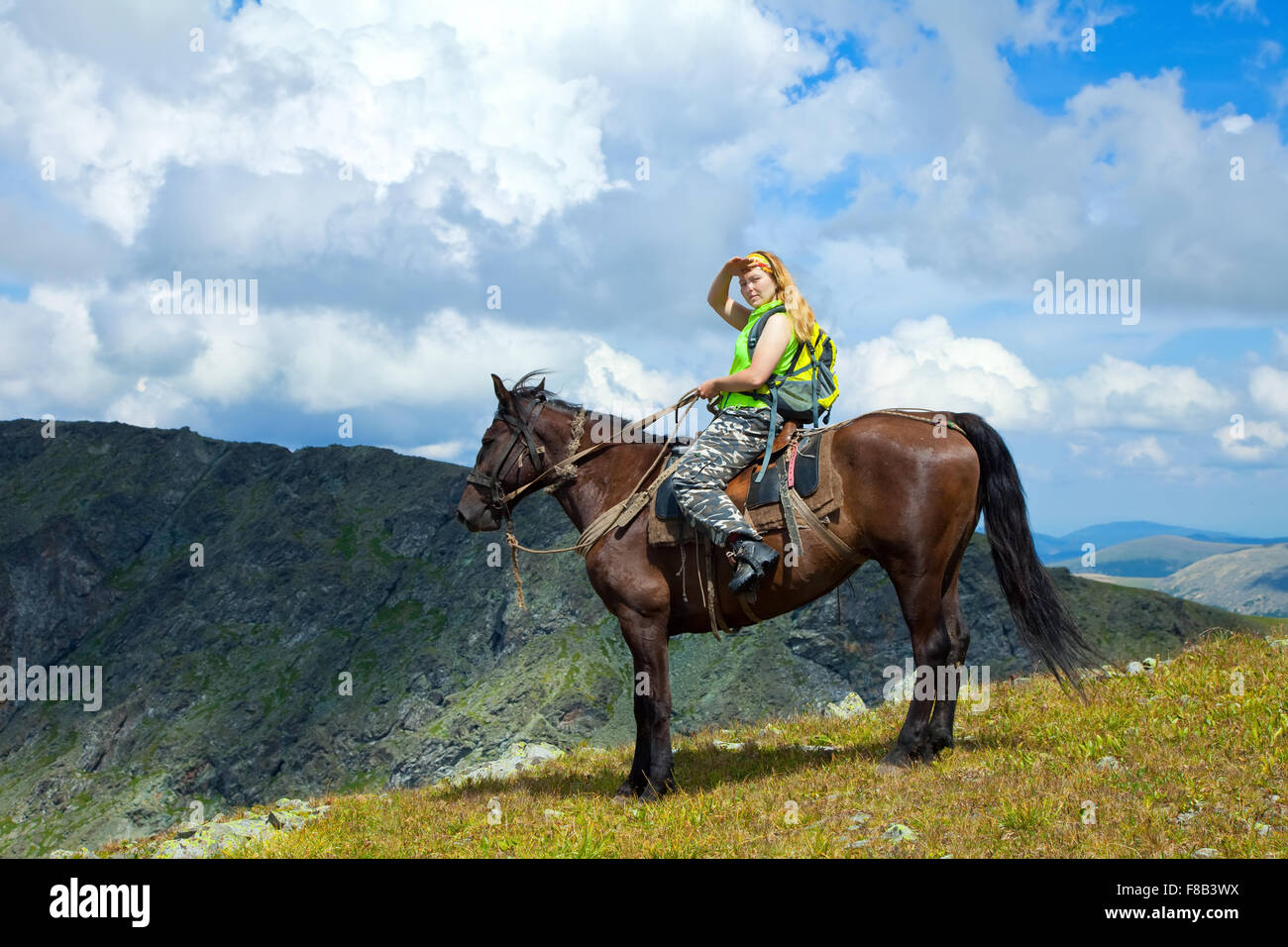 lone rider on horseback at mountains Stock Photo Alamy