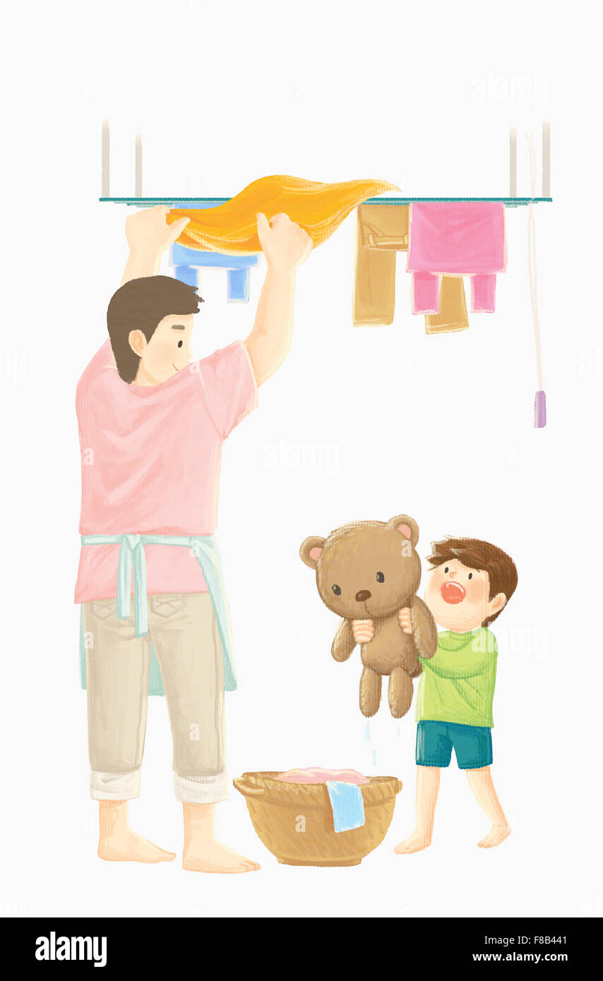 Man hanging the laundry to dry and boy holding teddy bear Stock Photo Alamy