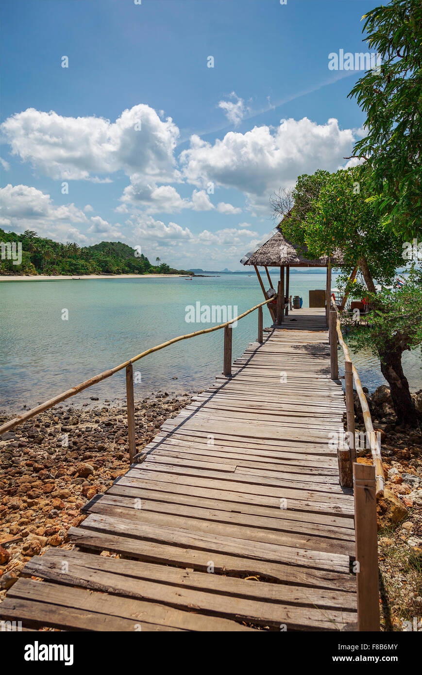 Image of a wooden jetty leading to a beach hut. Thailand. Stock Photo