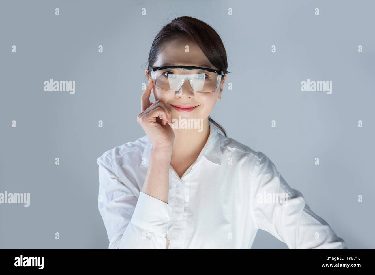Business woman wearing goggles and staring forward Stock Photo