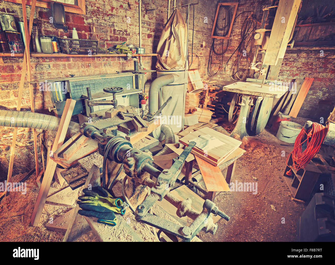 Vintage stylized old carpenter workshop interior. Stock Photo