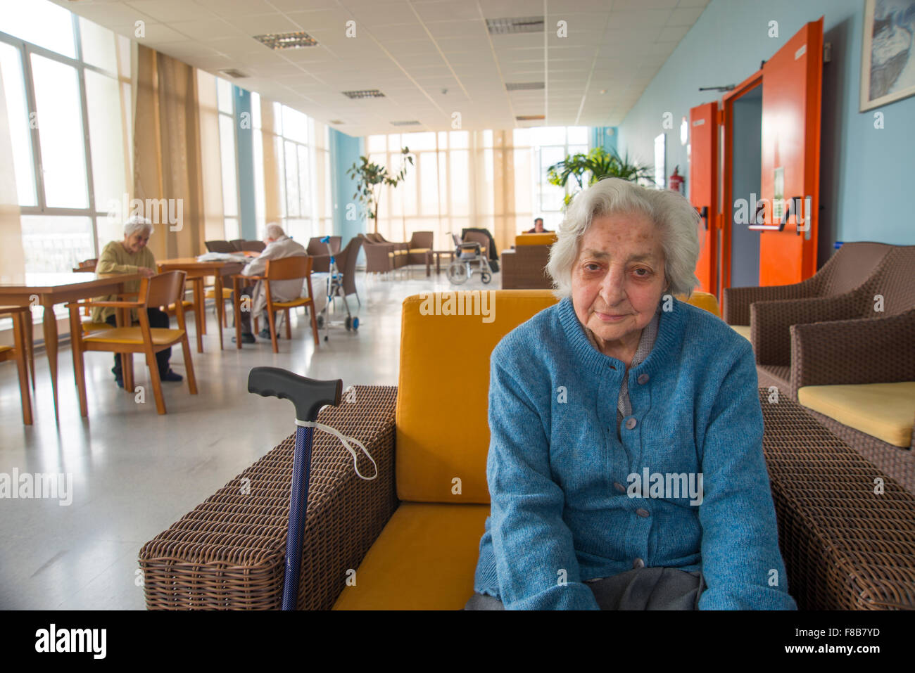 Portrait of old woman in a nursing home, smiling and looking at the camera. Stock Photo