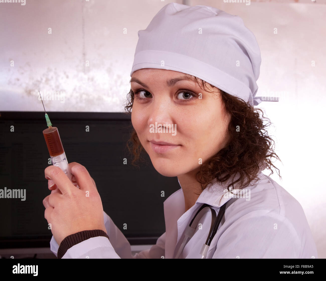 Portrait of nurse with syringe in clinic Stock Photo Alamy