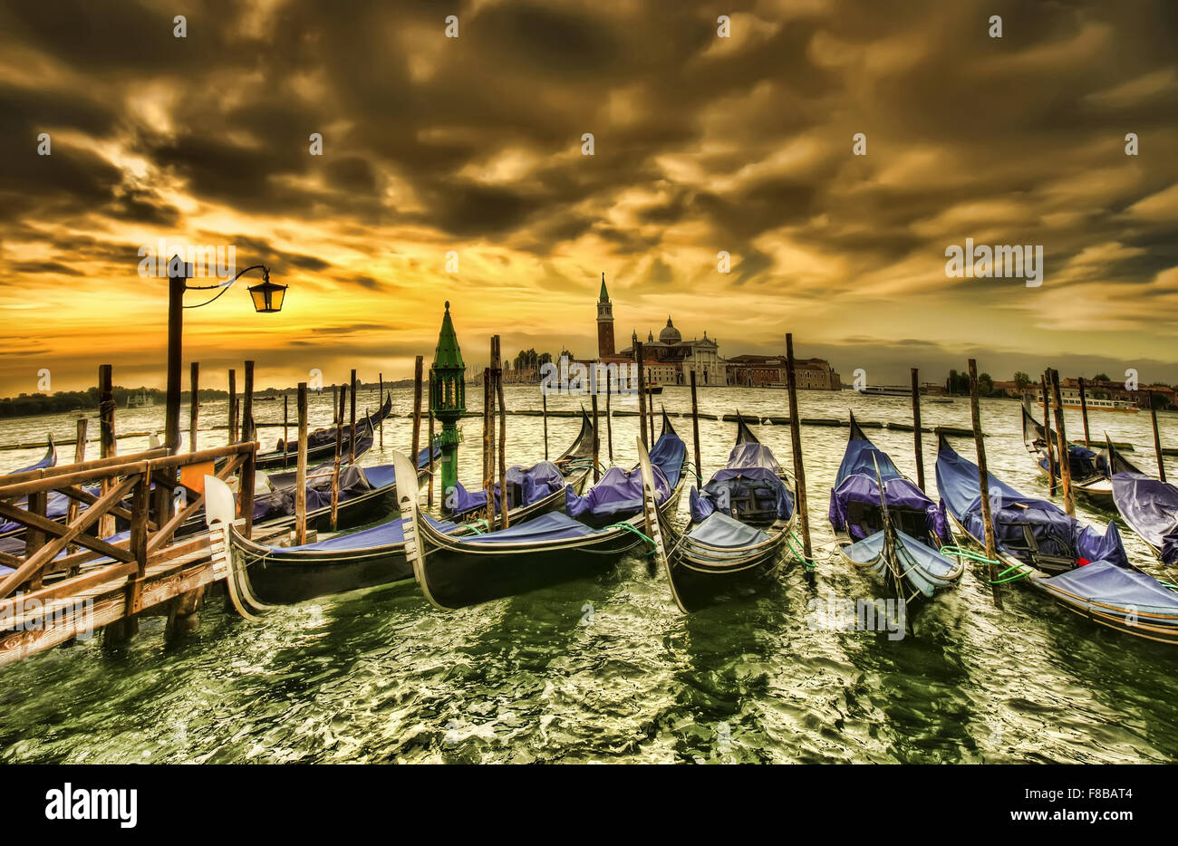 Venice dramatic scene with gondolas at sunset, Italy Stock Photo - Alamy