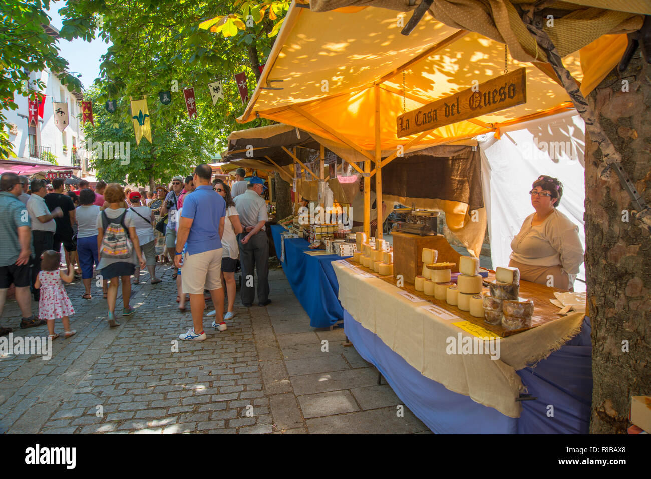 Cheese vendor stall in flea market. Cherry Festival, Covarrubias