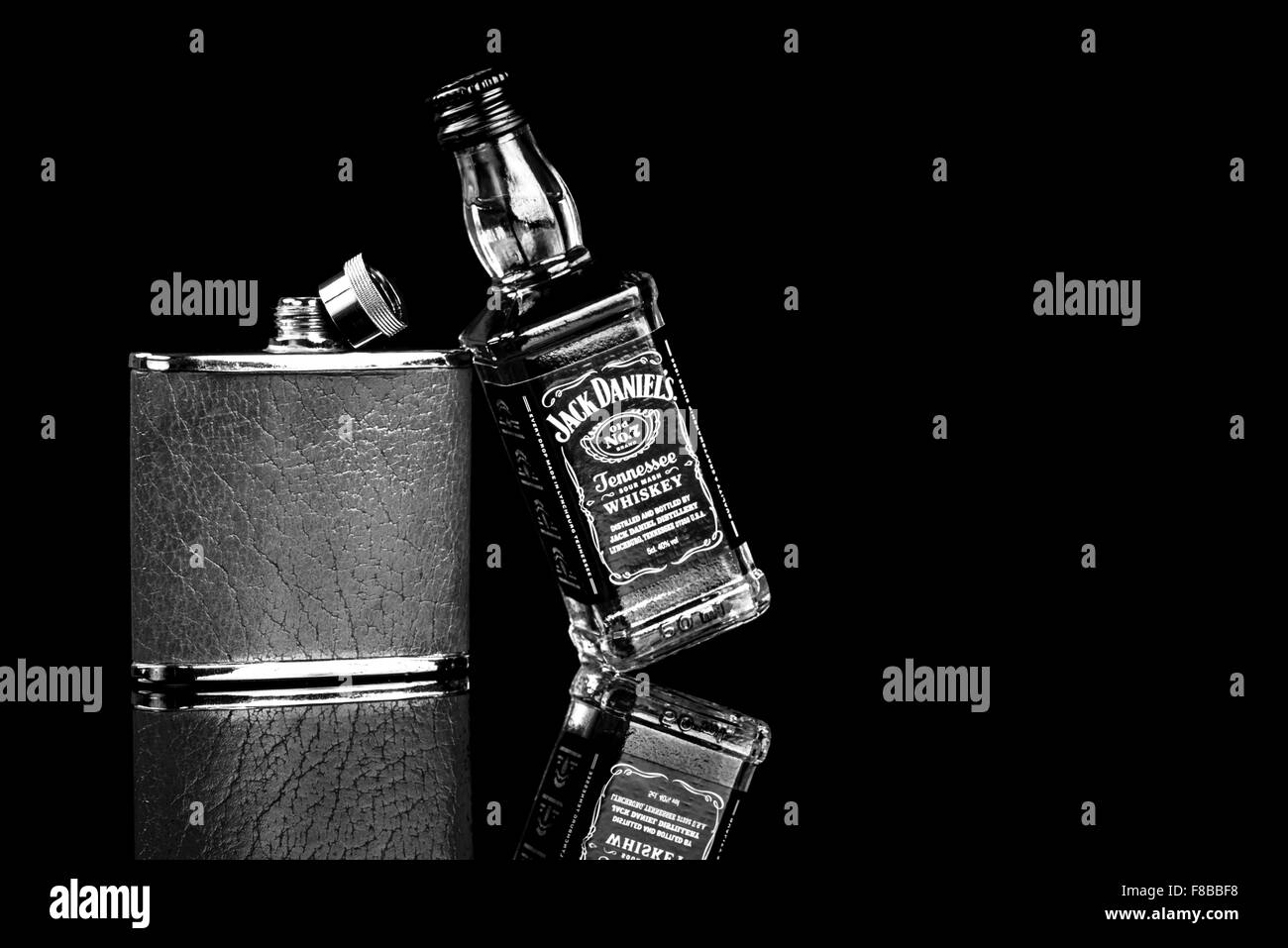 Black and white of Jack Daniels and hip flask Stock Photo