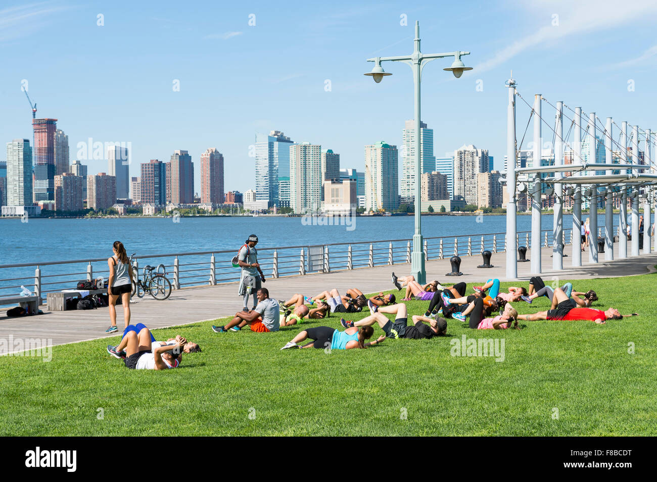 personal trainer, group class, fitness, workout, coach, class, exercise, wellbeing, fit, lifestyle, healthy lifestyle, park, tra Stock Photo