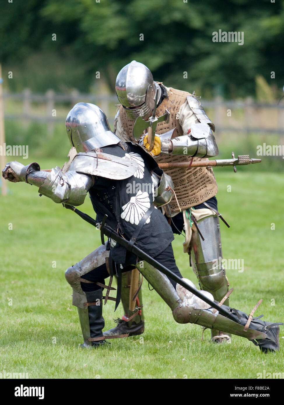 Castle Fraser, Scotland - 21st July 2013: Men dressed as a knights, demonstrating fighting at a medieval re-enactment event. Stock Photo