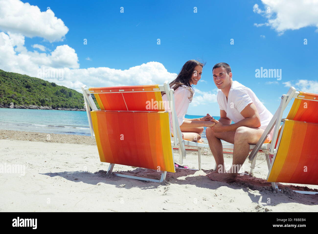 happy young couple have fun and relax on the beach Stock Photo - Alamy