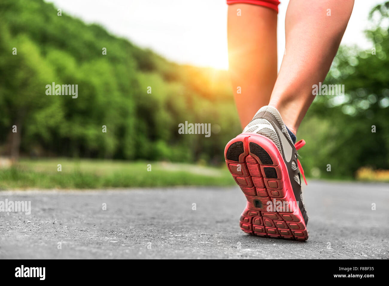 Athlete runner feet running on road Stock Photo Alamy