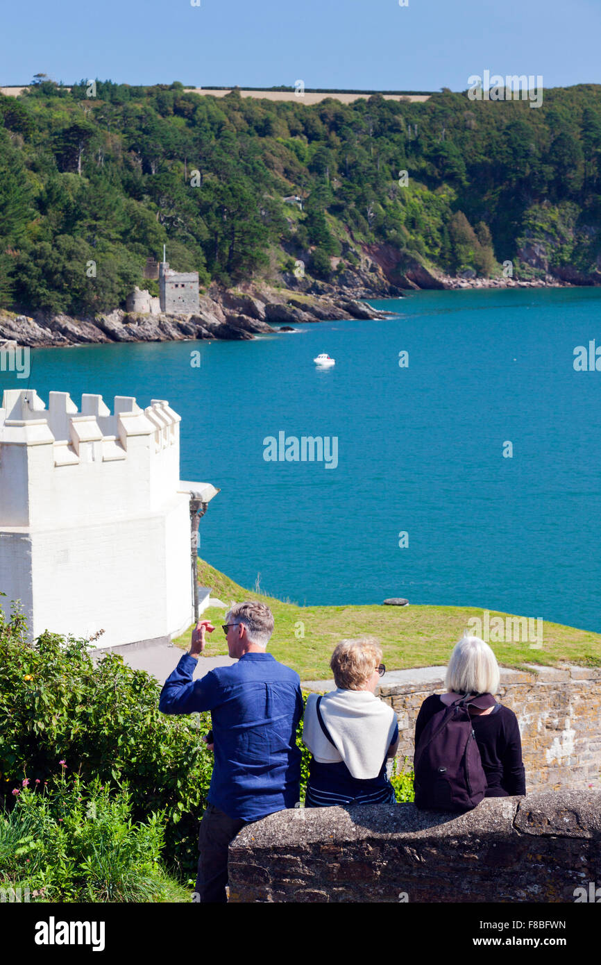 Visitors admiring the view of Kingswear Castle at the mouth of the River Dart, Devon, England, UK Stock Photo