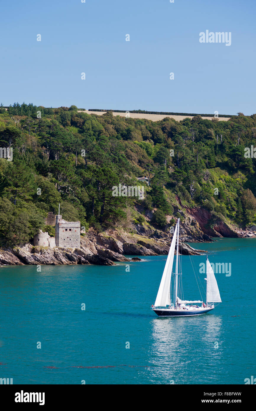 A yacht passes Kingswear Castle at the mouth of the River Dart, Devon, England, UK Stock Photo