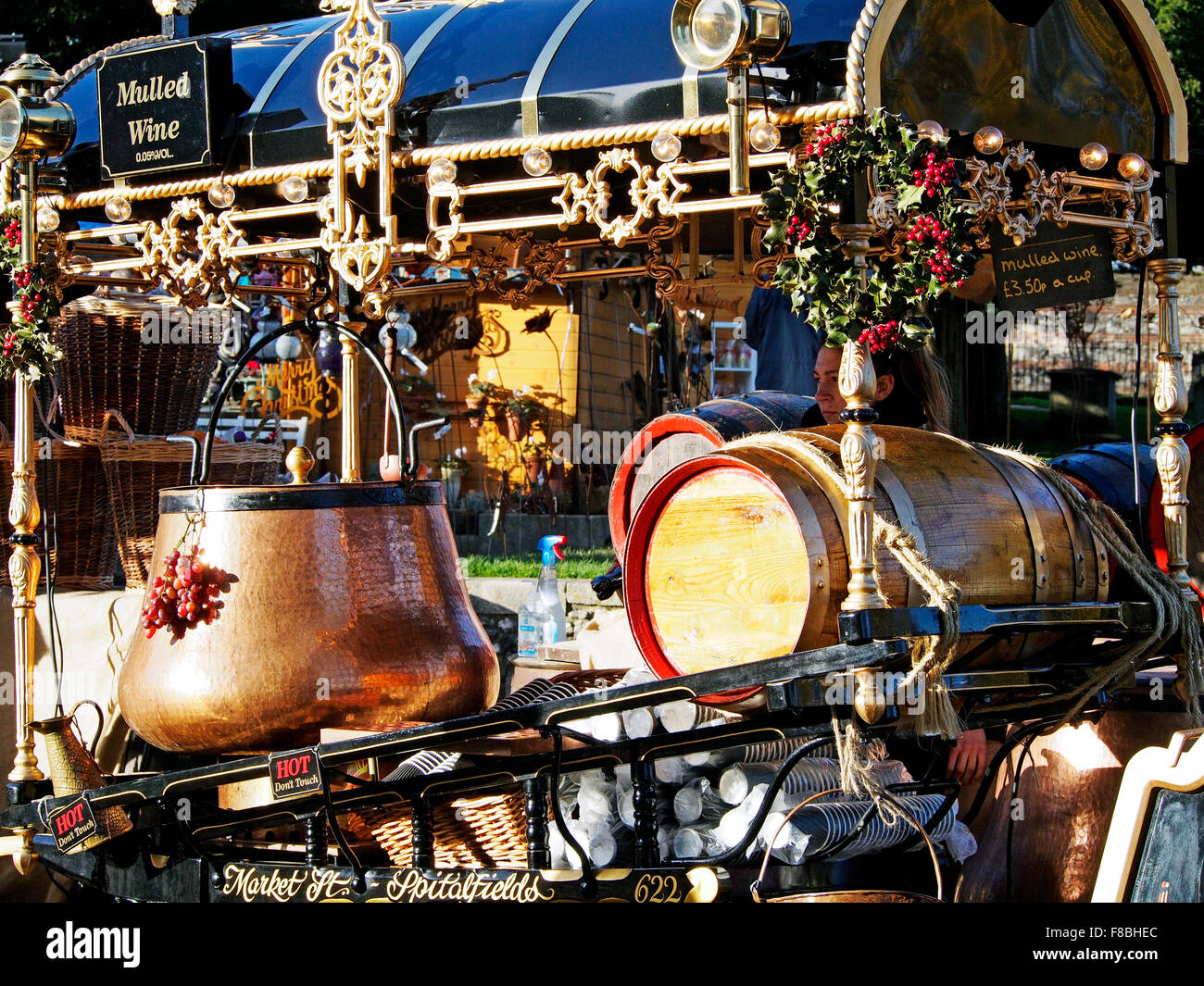 Costermonger's style carts at Winchester Cathedral Christmas Market in December 2015 selling donuts and mulled wine. Stock Photo