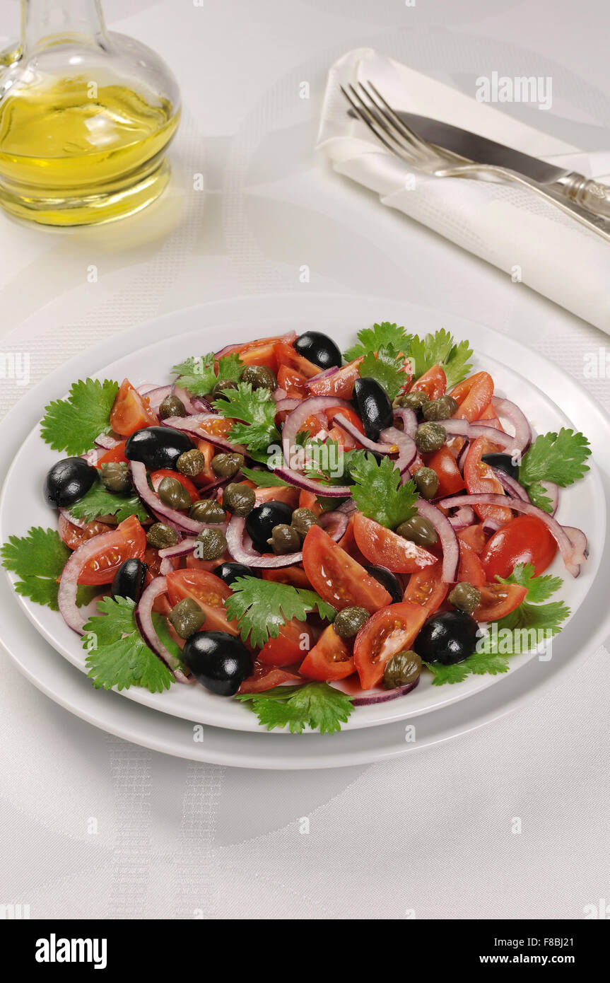 Cherry tomato salad with olives, capers and cilantro Stock Photo Alamy
