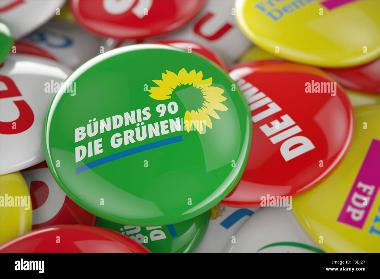 German political party Bündnis 90 Die Grünen button in front between other governing party buttons Stock Photo