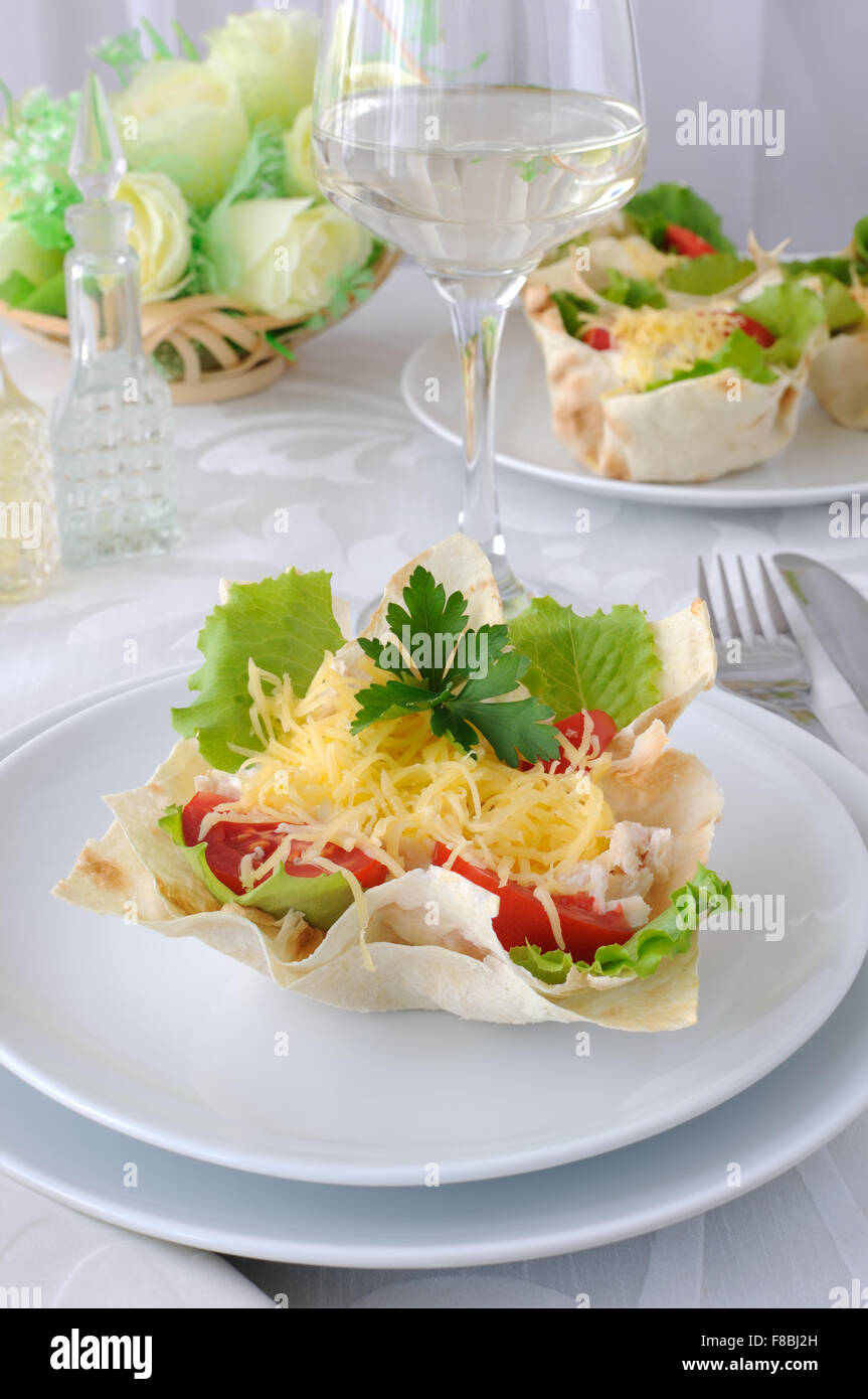 Chicken with tomatoes and cheese in a basket made of dough 'phyllo' Stock Photo