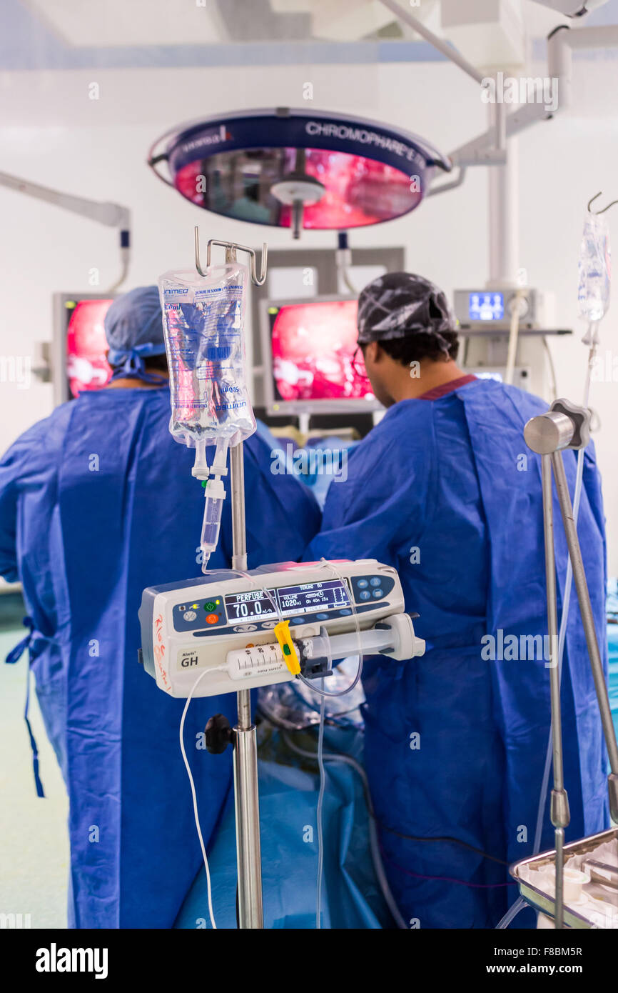 Surgical team performing prostatectomy (prostate ablation) under coeliosurgery. Stock Photo