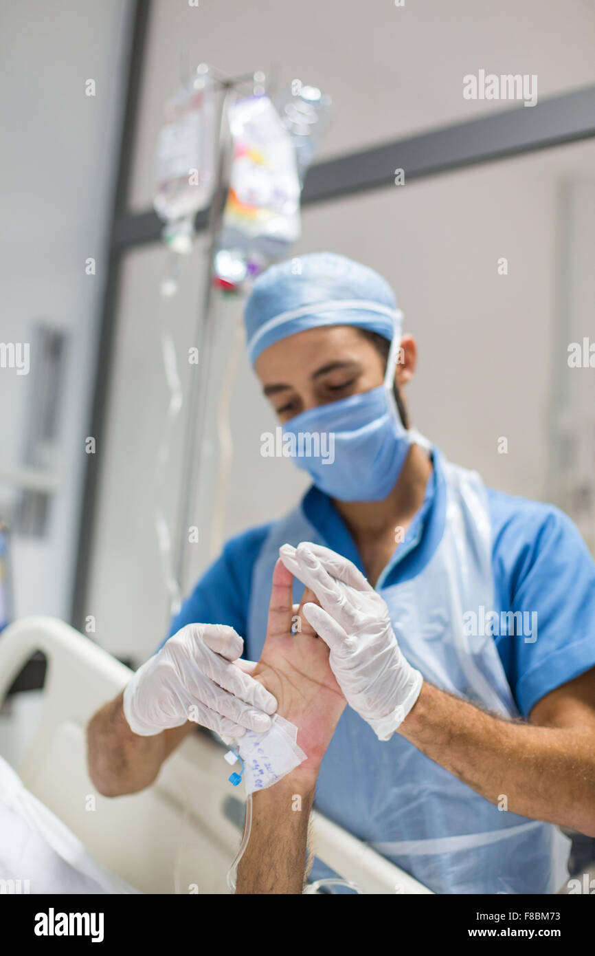 Physiotherapist with a patient in coma. Stock Photo