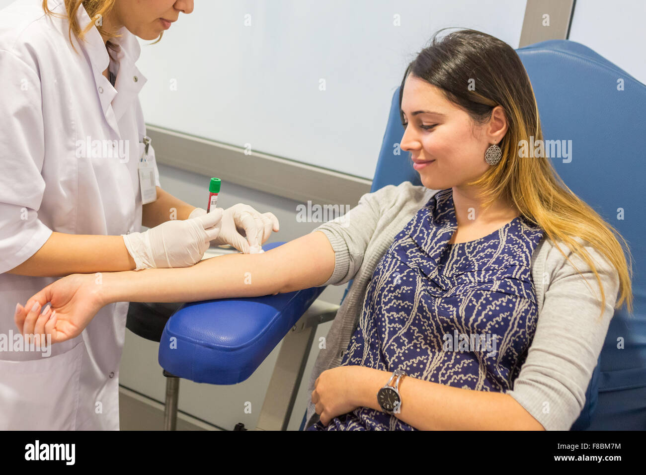 Young woman having a blood sample. Stock Photo
