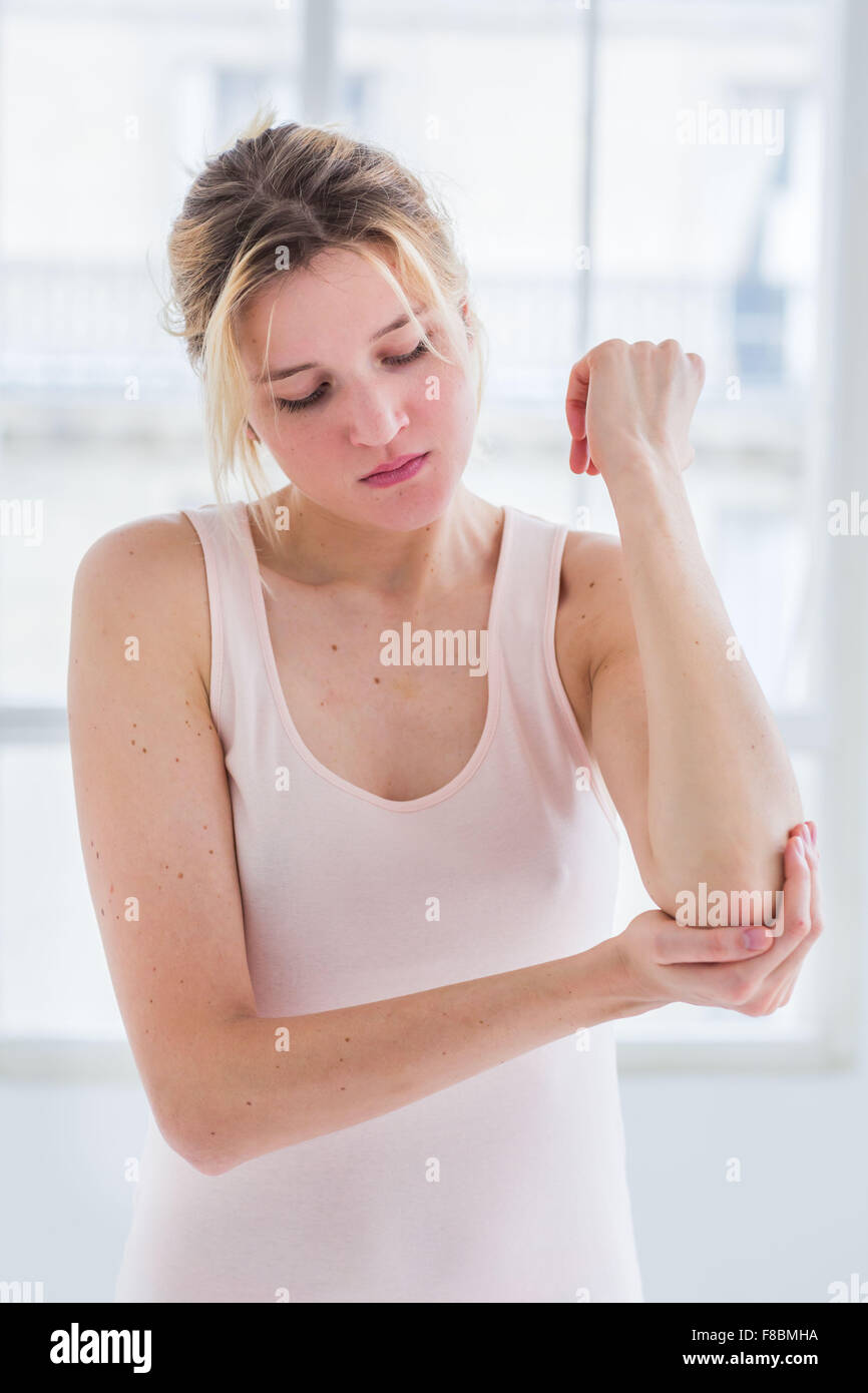Woman suffering from elbow pain. Stock Photo