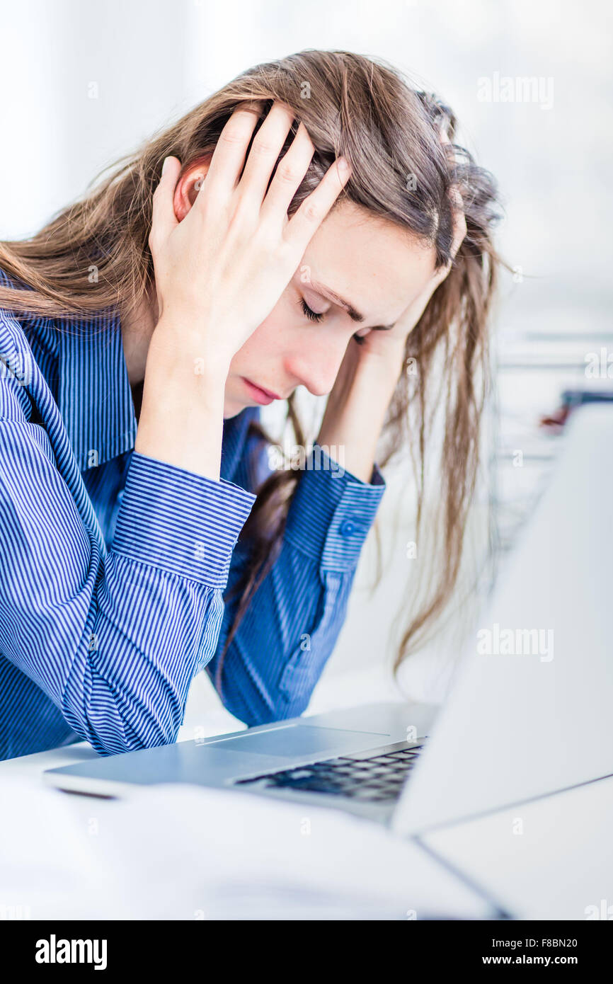 Tired woman at work. Stock Photo