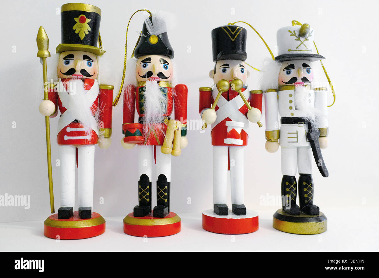 Christmas wooden nutcracker figures photographed against a white
